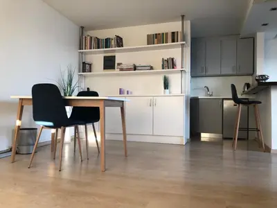 a kitchen with a table and chairs in a room at MV83 new marina in Rhodes Town