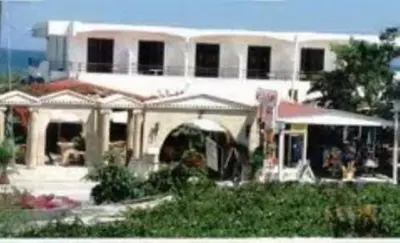 a large white house with anophe at Kitesurf Paradise Studios in Theologos