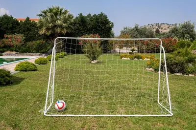 a soccer ball is in the net of a goal at Royal Classico Villa in Kolimbia