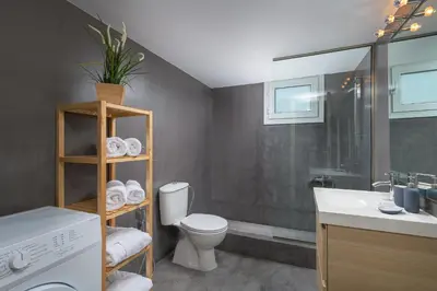a bathroom with a toilet and a sink and a shower at Melita City Apartment in Rhodes Town