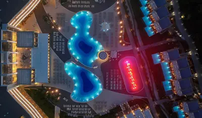 an overhead view of a city at night at Princess Andriana Resort & Spa - Ultra All-Inclusive in Kiotari