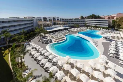 an aerial view of a resort with a swimming pool at Princess Andriana Resort & Spa - Ultra All-Inclusive in Kiotari