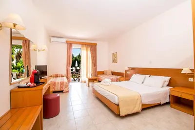 a large hotel room with a bed and a desk at Stavros Melathron Studios in Kallithea Rhodes