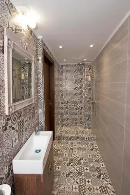 a bathroom with a sink and a shower at Arionos Rooms - Old Town in Rhodes Town