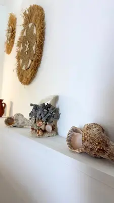 a shelf with some stuffed animals on a wall at Peters Studio in Archangelos