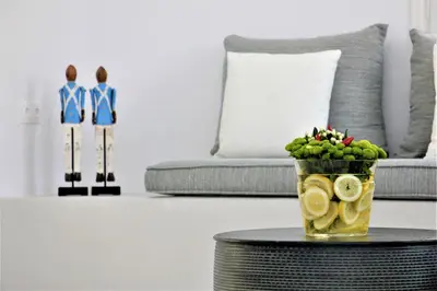 a vase of fruit on a table in a living room at 30villa Rd in Rhodes Town