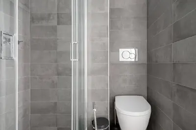 a bathroom with a toilet and a shower at 30villa Rd in Rhodes Town