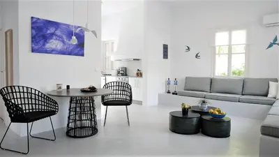 a living room with a table and chairs and a couch at 30villa Rd in Rhodes Town