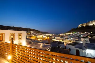 a view of a city at night at Villa Lindos in Líndos