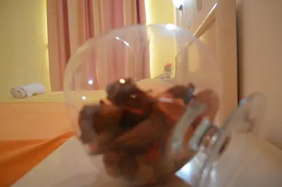 a glass ball on a table in a room at Kremasti Memories in Kremasti