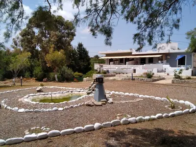 a rock garden in front of a house at Endless BLUE Lahania in Lachania