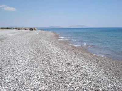 a beach with a rocky shore and the ocean at Endless BLUE Lahania in Lachania