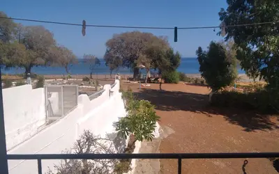 a view of the beach from the balcony of a building at Endless BLUE Lahania in Lachania