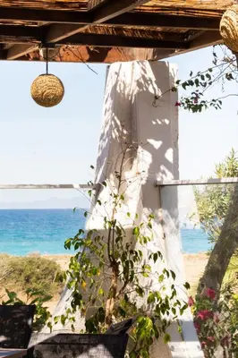 a view of the ocean from a house at Nirvana Beach Hotel in Theologos