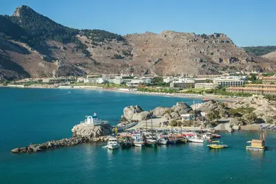 a group of boats are docked in a body of water at Kolymbia Sun in Kolimbia