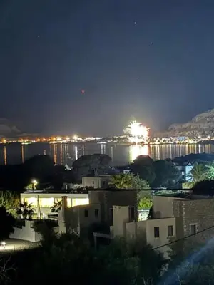 a view of a city at night with a bridge at George Beach Studios in Pefki Rhodes