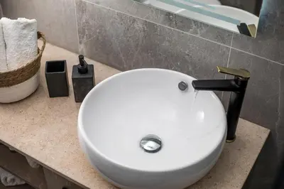 a white sink on a counter in a bathroom at Jimmy’s Garden in Faliraki