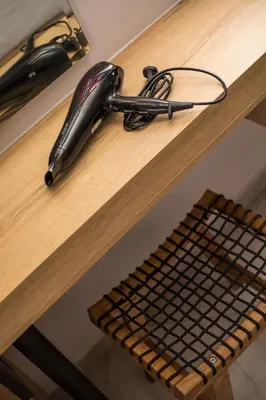 a desk with a cord plugged into at Jimmy’s Garden in Faliraki