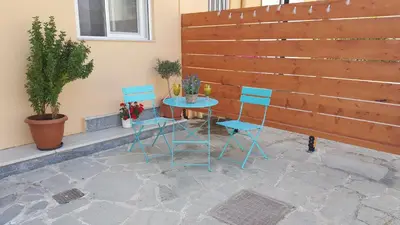 a table and two chairs sitting on a patio at Maximos Sea & The City in Rhodes Town