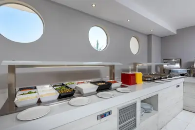 a kitchen with a counter with food on it at Afandou Blu in Afantou