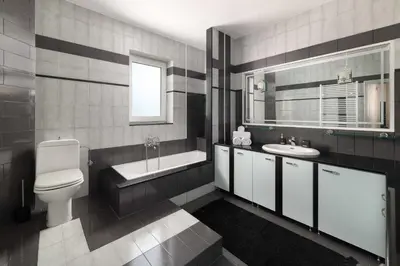 a bathroom with a toilet and a sink and a tub at Villa Sophia in Soroni