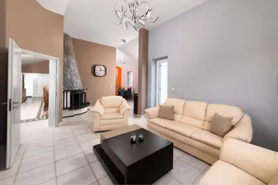a living room with a couch and a coffee table at Villa Sophia in Soroni