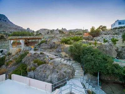 an overhead view of a mountain with stairs and rocks at Villa Rose in Archangelos