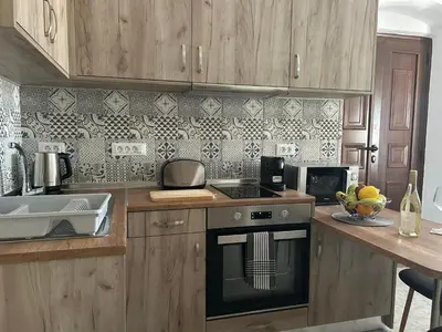 a kitchen with a stove and a counter with a sink at New Lindos Studio 45 renovated in Líndos