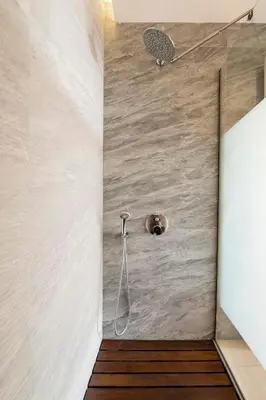 a shower with a shower head in a bathroom at Traditional Lindian Suites in Líndos