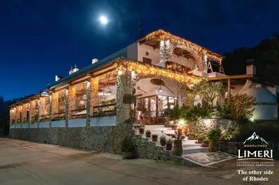a building with lights on it at night at Limeri Traditional Guest House in Monólithos