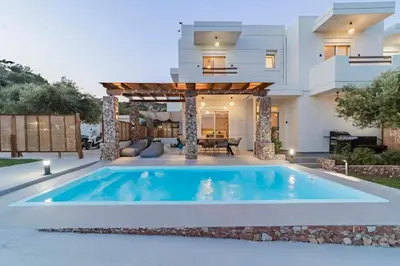 a swimming pool in the backyard of a house at Villa Tranquila Rhodes in Psinthos