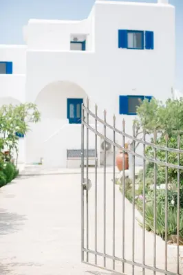 a metal fence in front of a building at Ktima Tzaneti in Lachania
