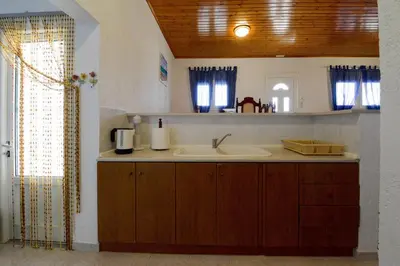 a bathroom with a sink and a mirror at Villa Fantasea in Plimmiri