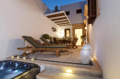 a living room with a couch and a table at Lindos Vista Luxury Villa in Líndos