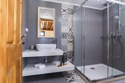 a bathroom with a sink and a shower at Lindos Vista Luxury Villa in Líndos