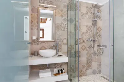 a bathroom with a sink and a shower at Lindos Vista Luxury Villa in Líndos