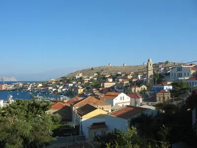 a view of a city with houses and a hill at Villa Katingo in Halki