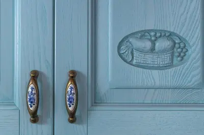 a blue door with a design of a basket on it at Villa Katingo in Halki