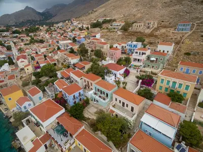 an aerial view of a town with colorful houses at Filoxenia Apartments in Halki