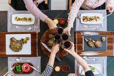 a person taking a picture of a table of food at Gennadi Grand Resort - Premium All Inclusive in Gennadi