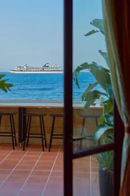 a view of the ocean from a room with a window at Grande Albergo Delle Rose in Rhodes Town