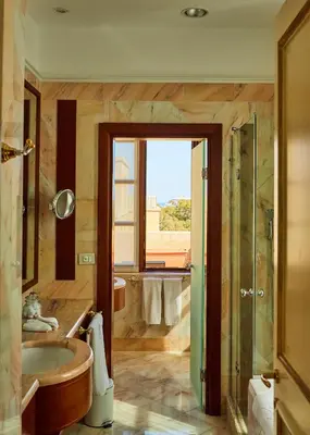 a bathroom with a tub and a shower and a sink at Grande Albergo Delle Rose in Rhodes Town
