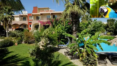 a resort with a bird statue next to a pool at Hotel Kalithea in Kallithea Rhodes