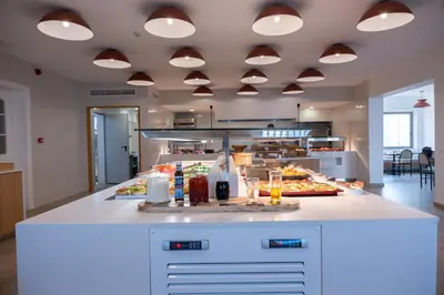 a kitchen with a buffet of food on a counter at Orion Hotel in Faliraki