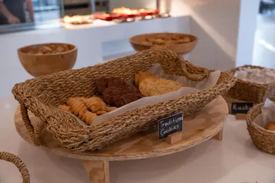 a basket filled with different types of cookies on a shelf at Orion Hotel in Faliraki