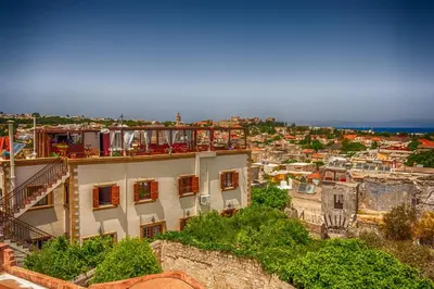 a view of a city from a building at Minos Pension in Rhodes Town