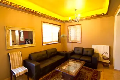 a living room with a couch and a table at Minos Pension in Rhodes Town
