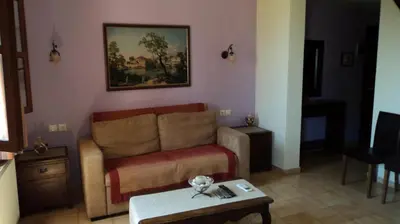a living room with a couch and a table at Minos Pension in Rhodes Town