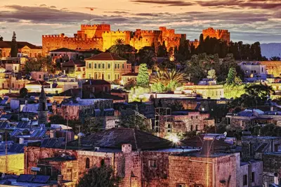 a cityscape of a city with a castle in the background at Minos Pension in Rhodes Town