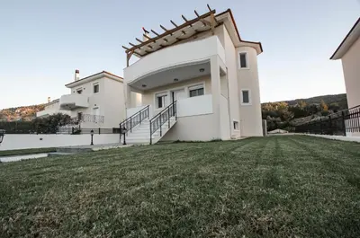 a house with a large yard in front of it at Butterfly Estates Maritsa Rhodes in Pastida